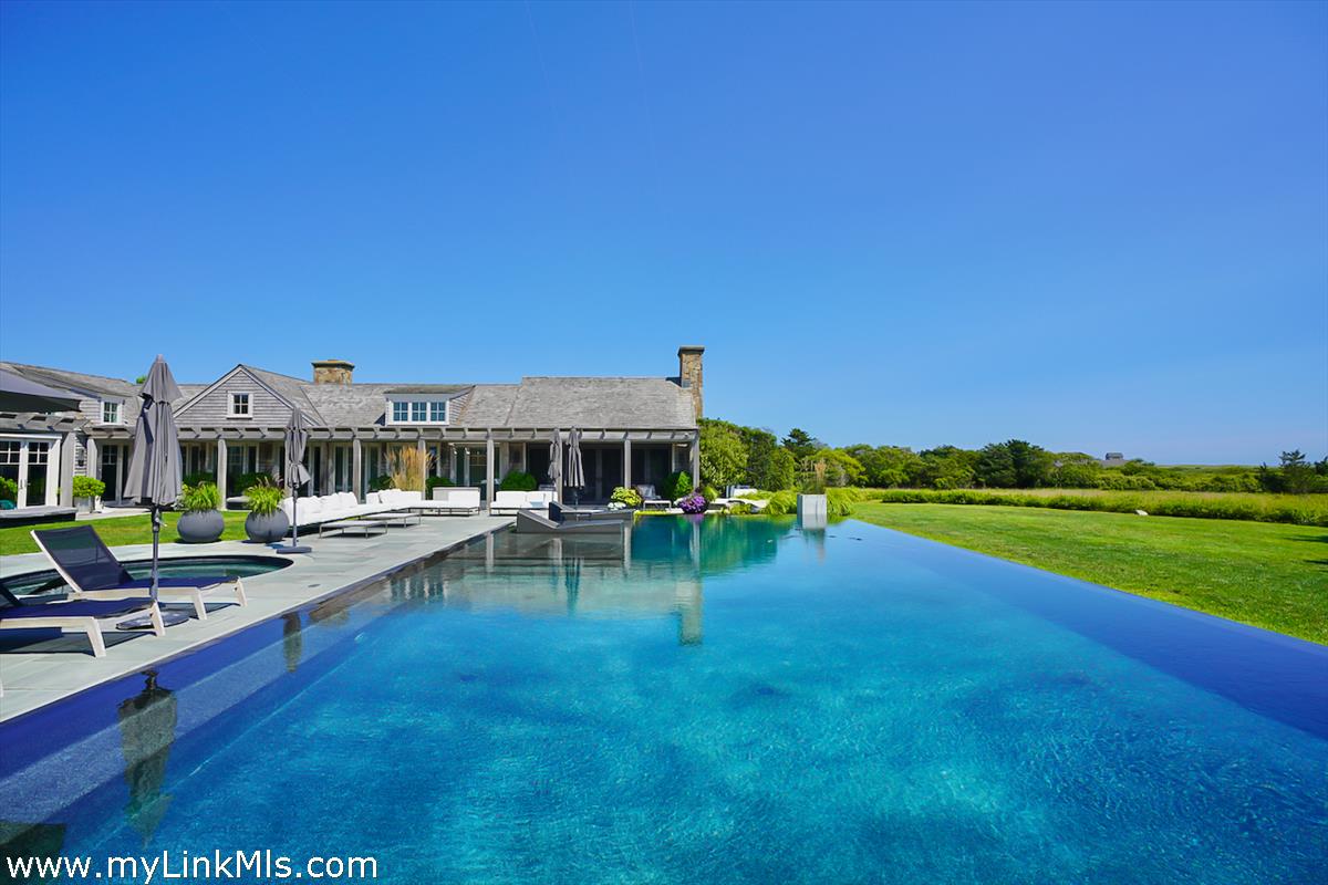 30 Crackatuxet Road Edgartown, MA 02539 - Photo 35 of 45 a view of a house with backyard porch and sitting area