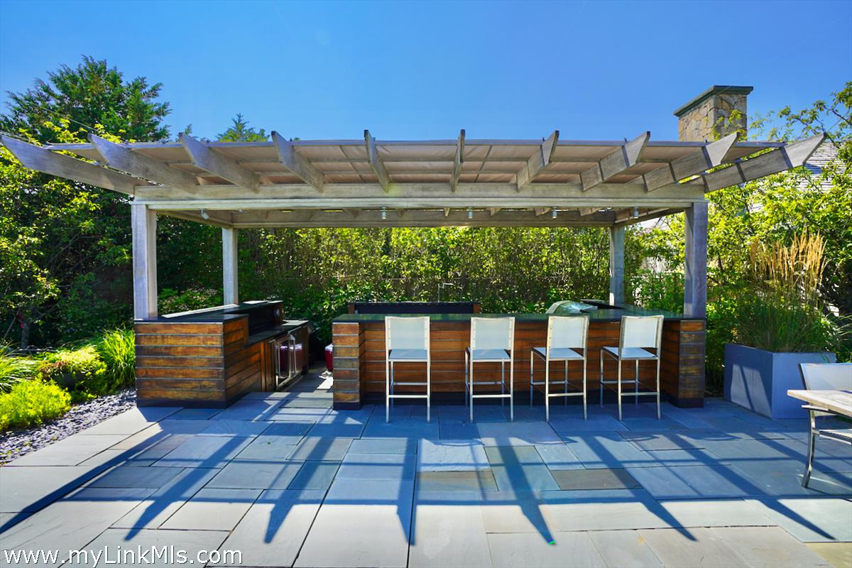 30 Crackatuxet Road Edgartown, MA 02539 - Photo 36 of 45 a view of a patio with couple of chairs and potted plants