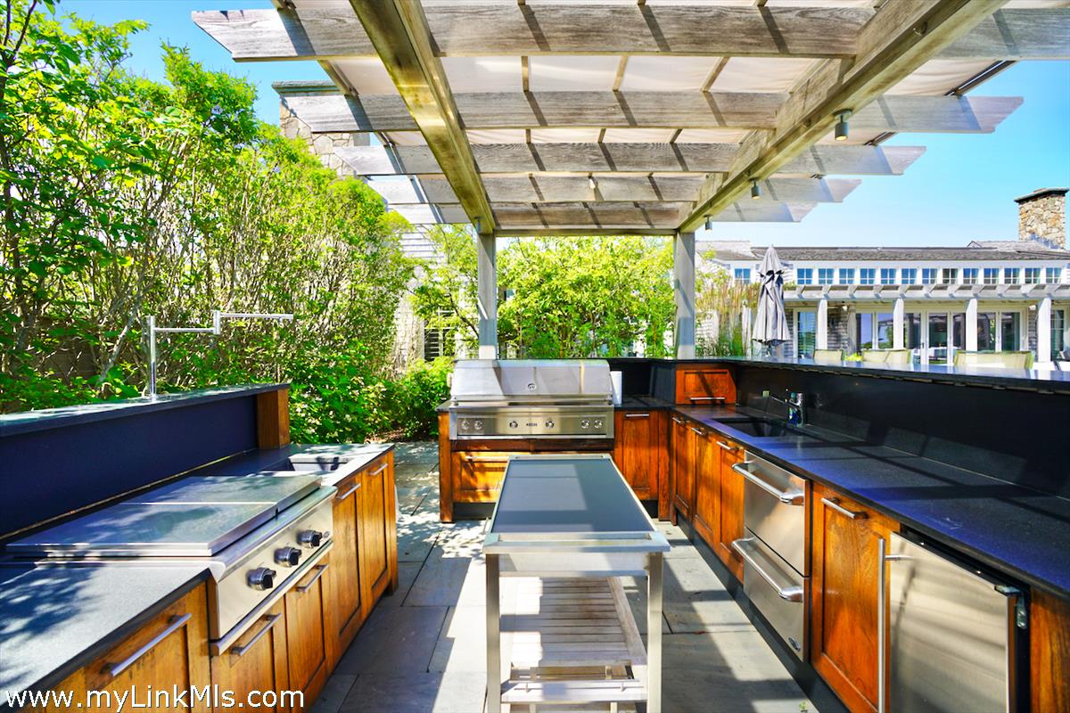 30 Crackatuxet Road Edgartown, MA 02539 - Photo 39 of 45 a view of a balcony with chairs