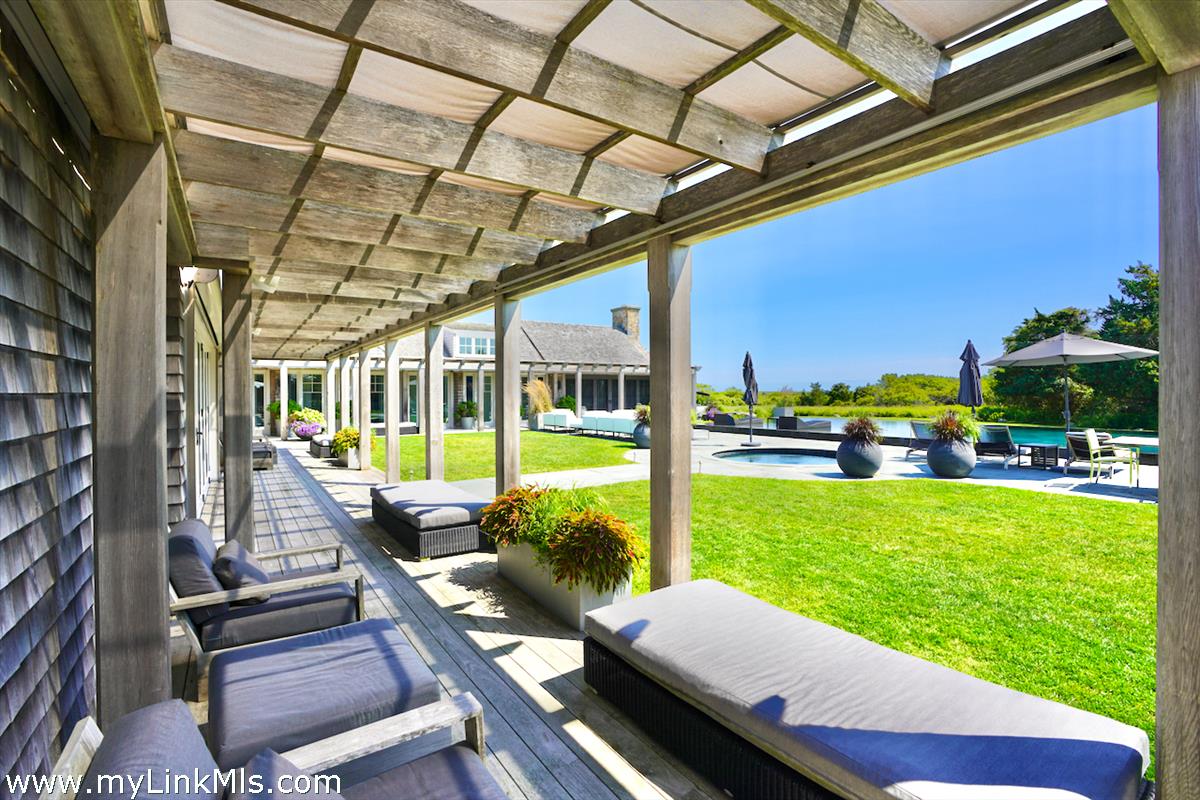 30 Crackatuxet Road Edgartown, MA 02539 - Photo 42 of 45 a view of a swimming pool with a patio