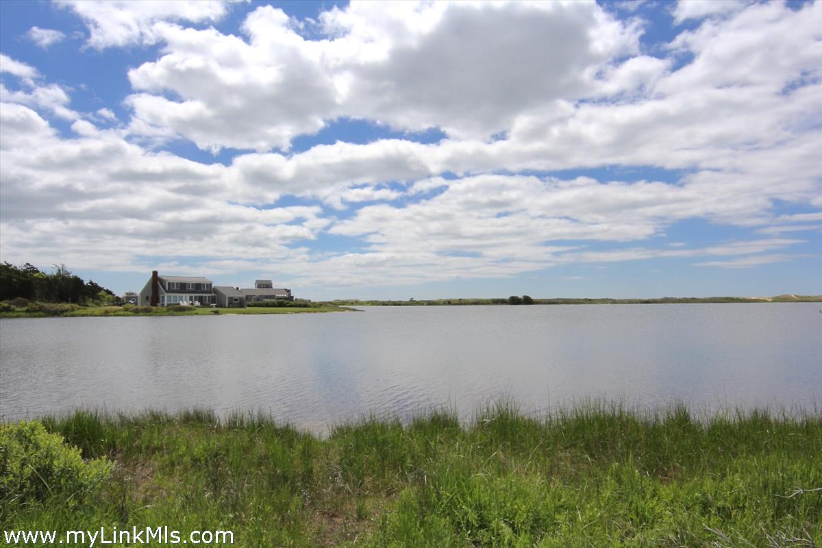 30 Crackatuxet Road Edgartown, MA 02539 - Photo 45 of 45 a view of a lake from a yard