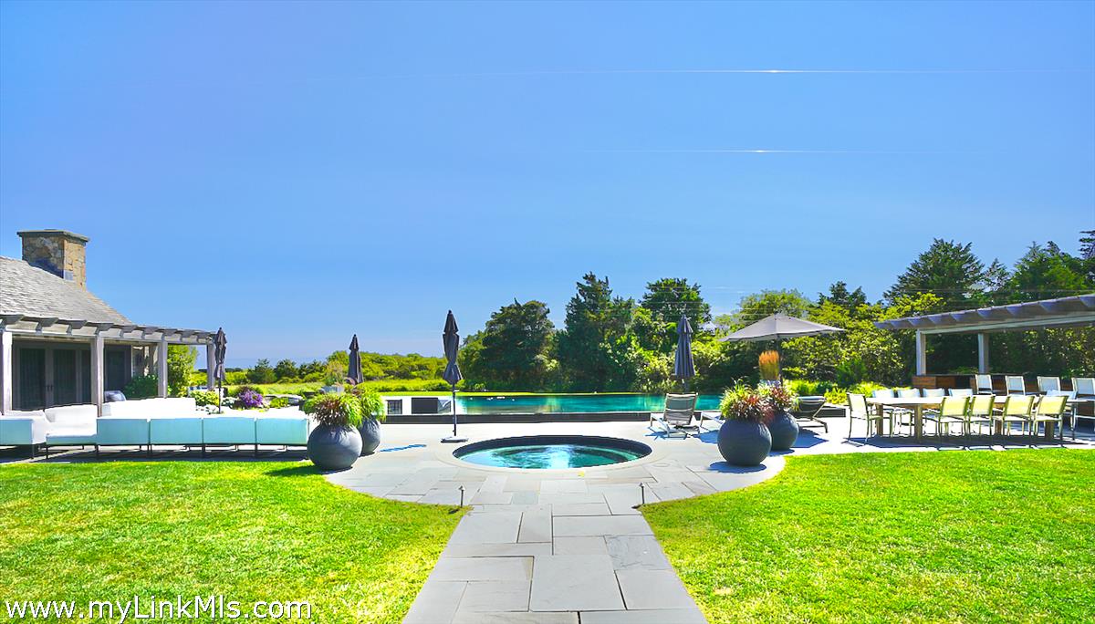 30 Crackatuxet Road Edgartown, MA 02539 - Photo 5 of 45 a view of a swimming pool with a patio