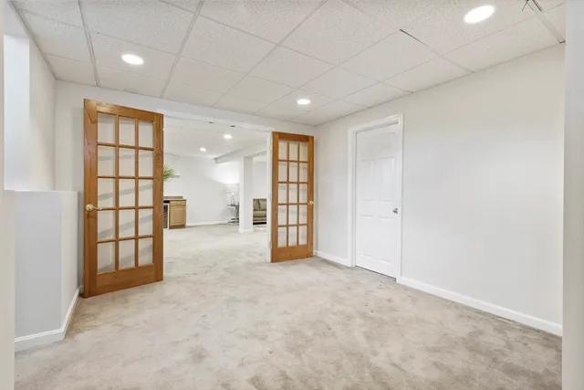 a view of a hallway with a car and a garage