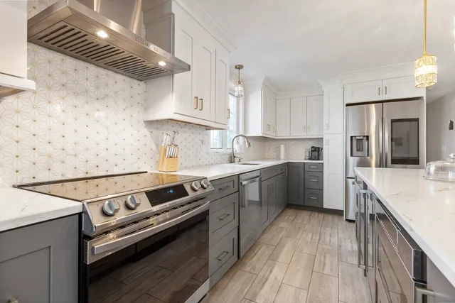a kitchen with a stove oven and sink