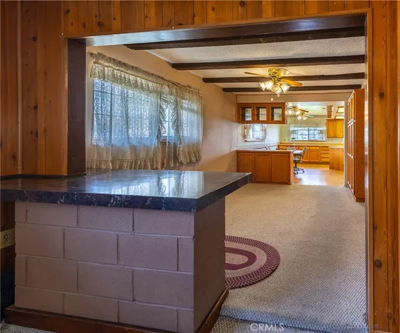 a kitchen with stainless steel appliances granite countertop a sink and cabinets