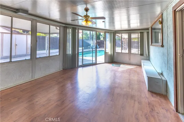 a view of an entryway with wooden floor