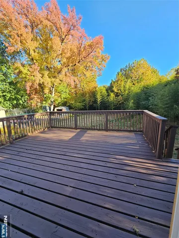 a view of deck with wooden floor and chair