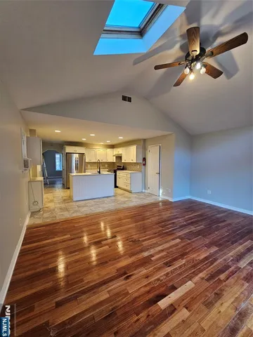 a view of a room with a flat screen tv