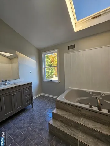 a bathroom with a sink and a bathtub