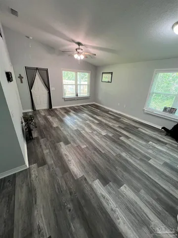 wooden floor and windows in a room