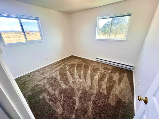 a view of a window in an empty room