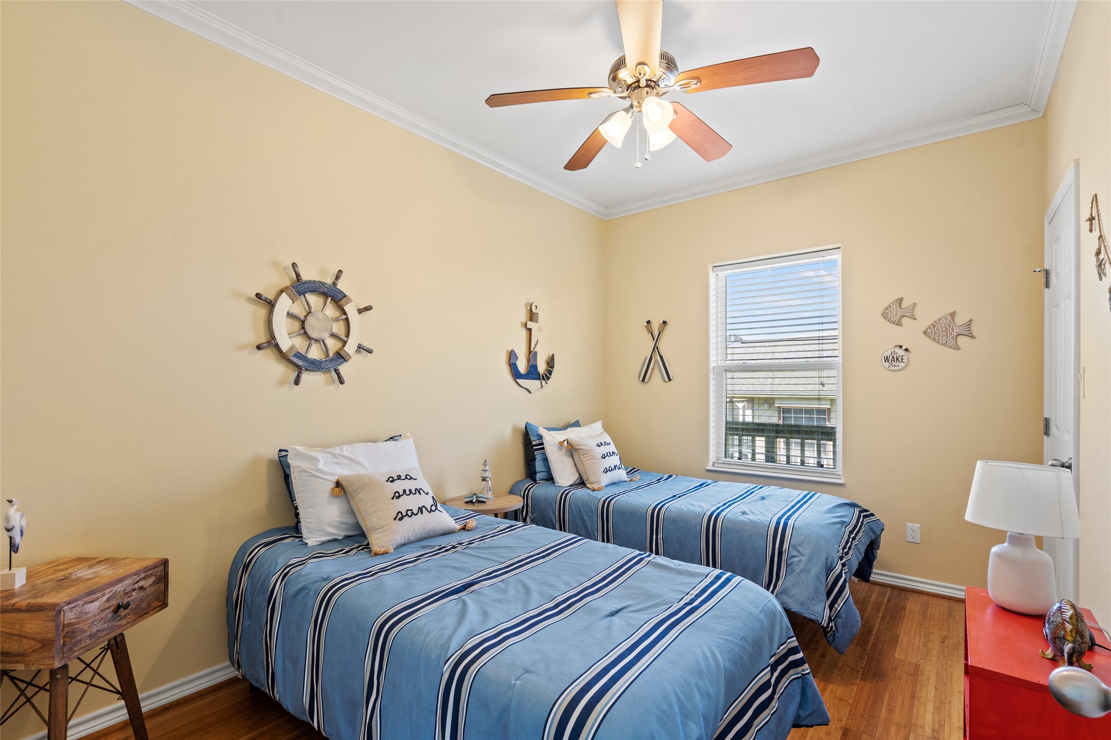 3923 Reeves Drive Galveston, TX 77554 - Photo 15 of 36 a bedroom with bed and a chandelier