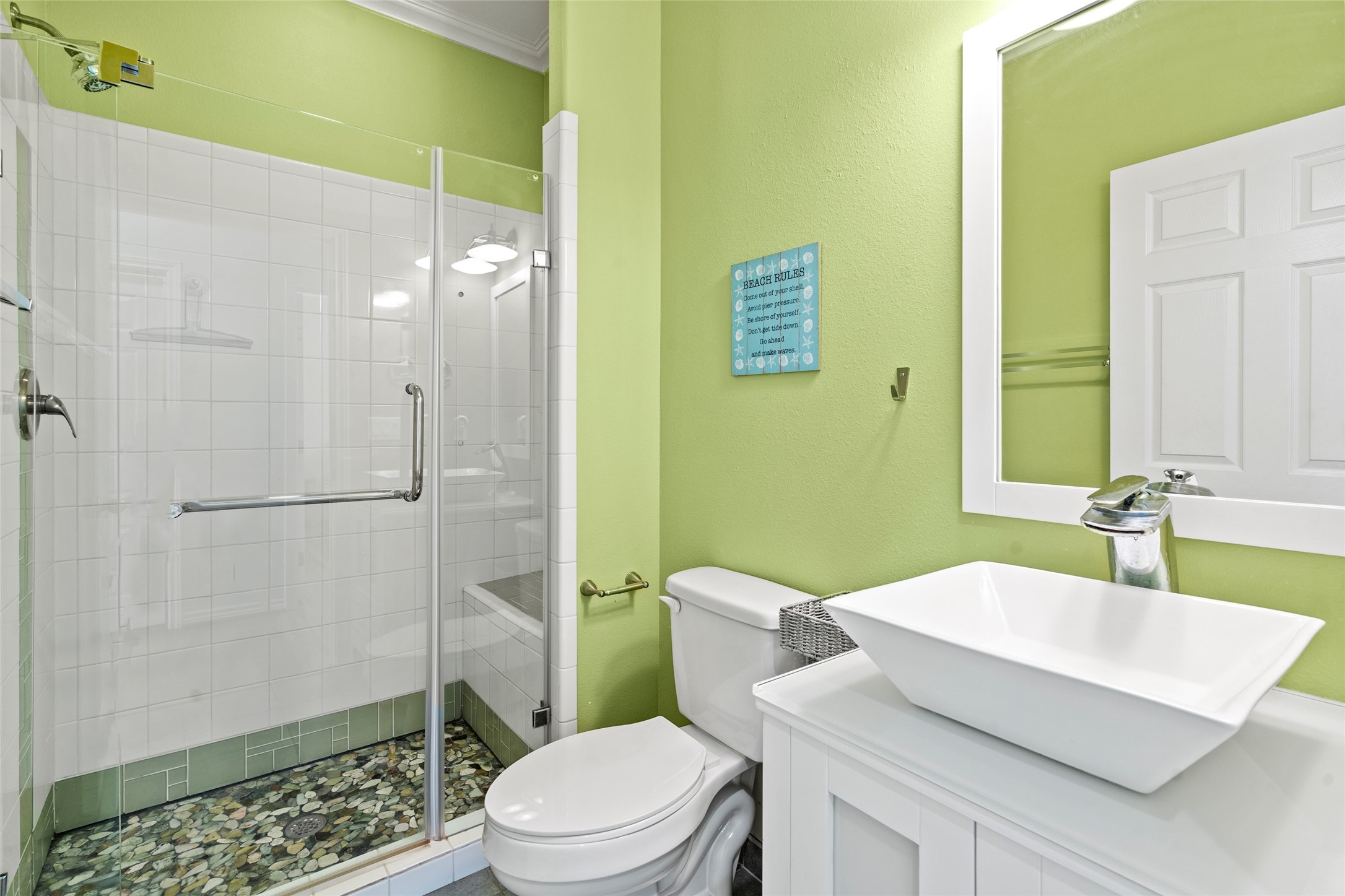 3923 Reeves Drive Galveston, TX 77554 - Photo 17 of 36 a bathroom with a sink a toilet and shower