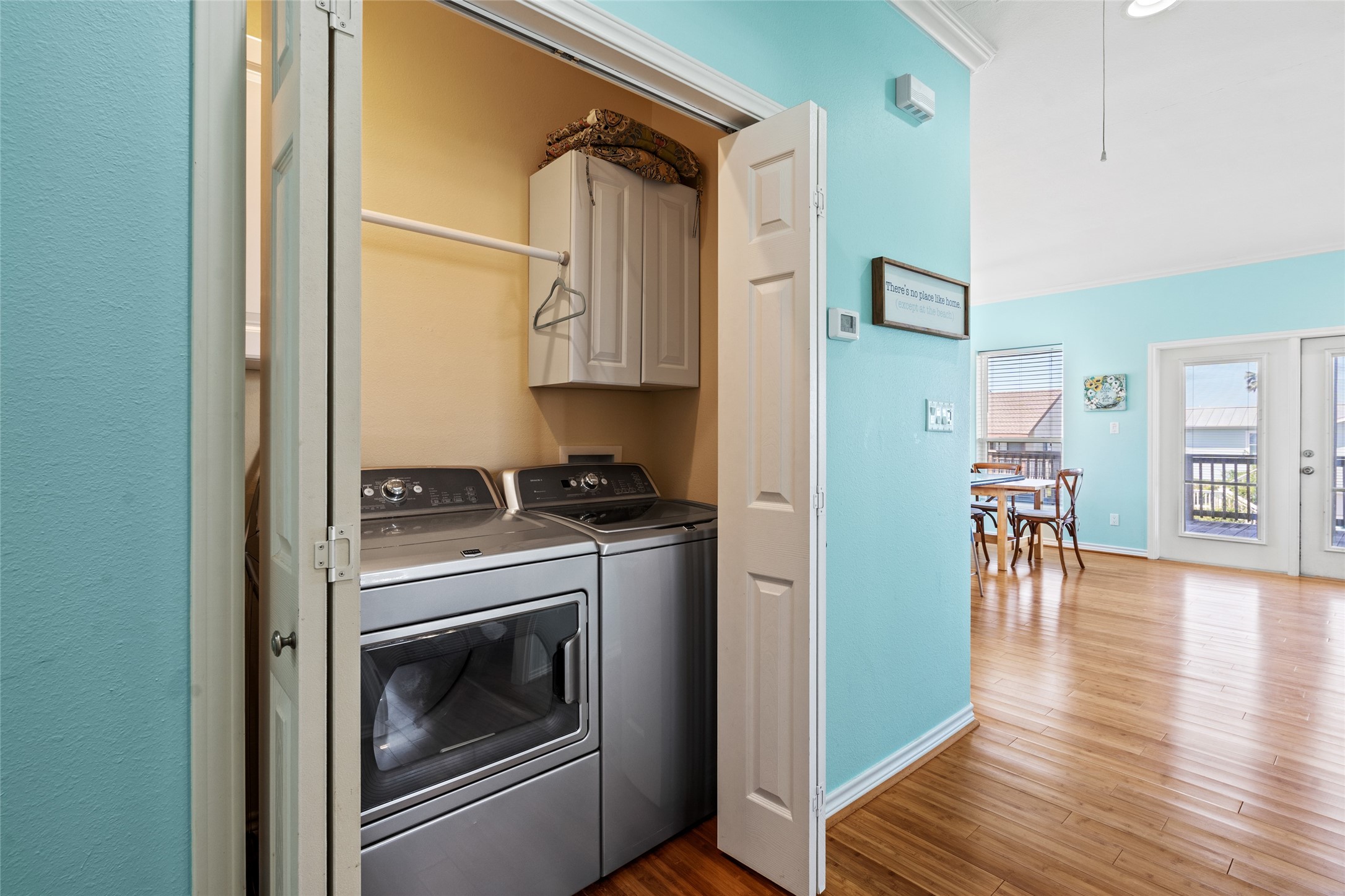 3923 Reeves Drive Galveston, TX 77554 - Photo 23 of 36 a kitchen with a stove and wooden floor