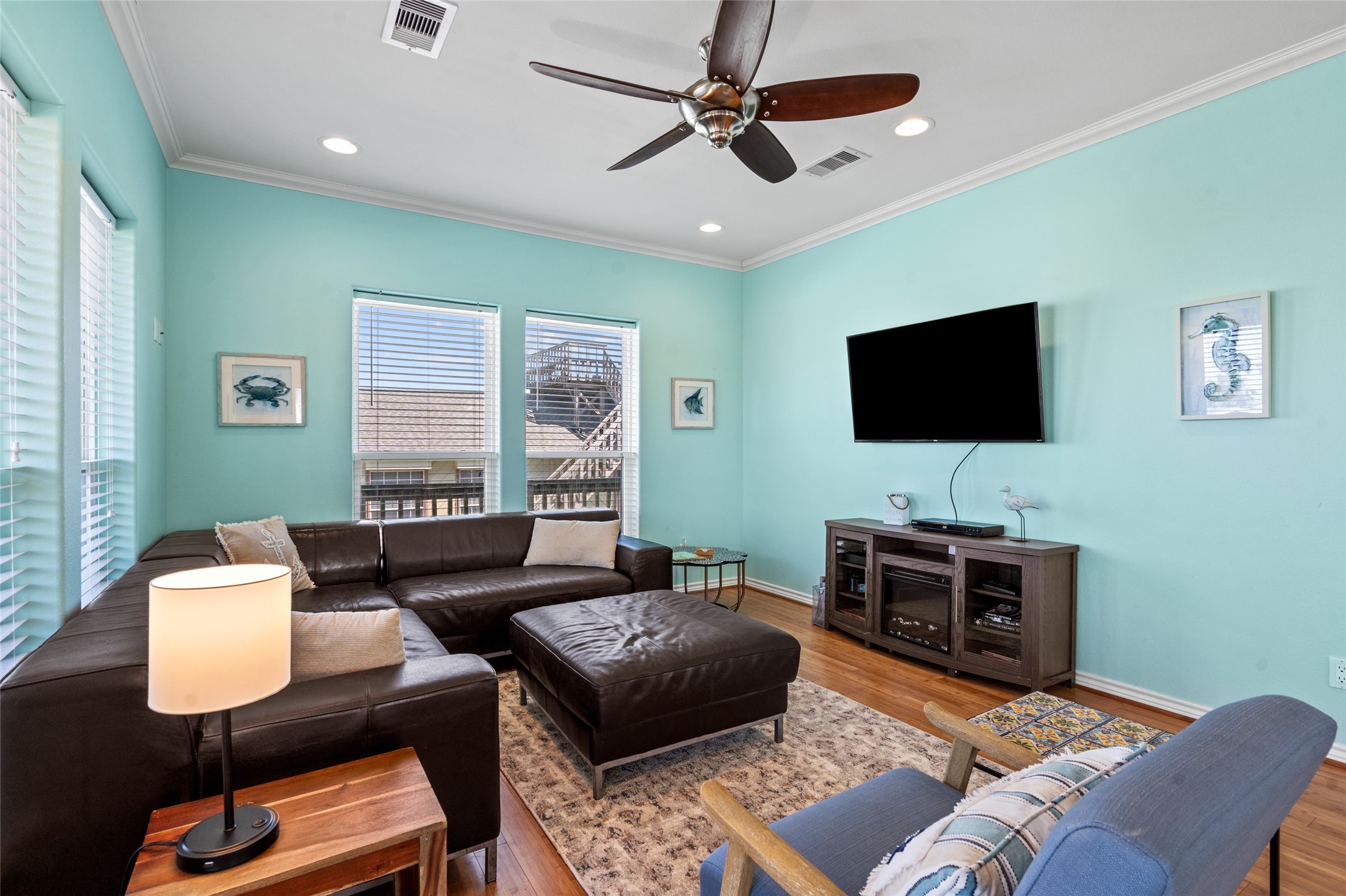 3923 Reeves Drive Galveston, TX 77554 - Photo 6 of 36 a living room with furniture and a flat screen tv