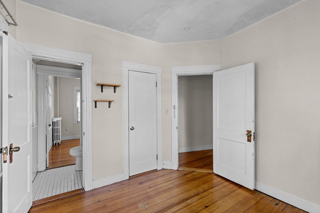 227 Winchester Street, Unit A Brookline, MA 02446 - Photo 13 of 18 wooden floor in a gallery