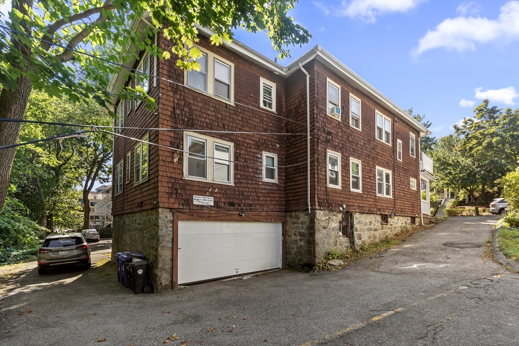 227 Winchester Street, Unit A Brookline, MA 02446 - Photo 17 of 18 a view of a street with a cars parked in front of it