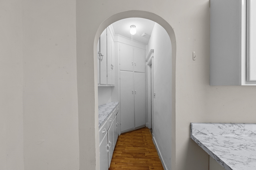 227 Winchester Street, Unit A Brookline, MA 02446 - Photo 9 of 18 a view of a bathroom from the hallway