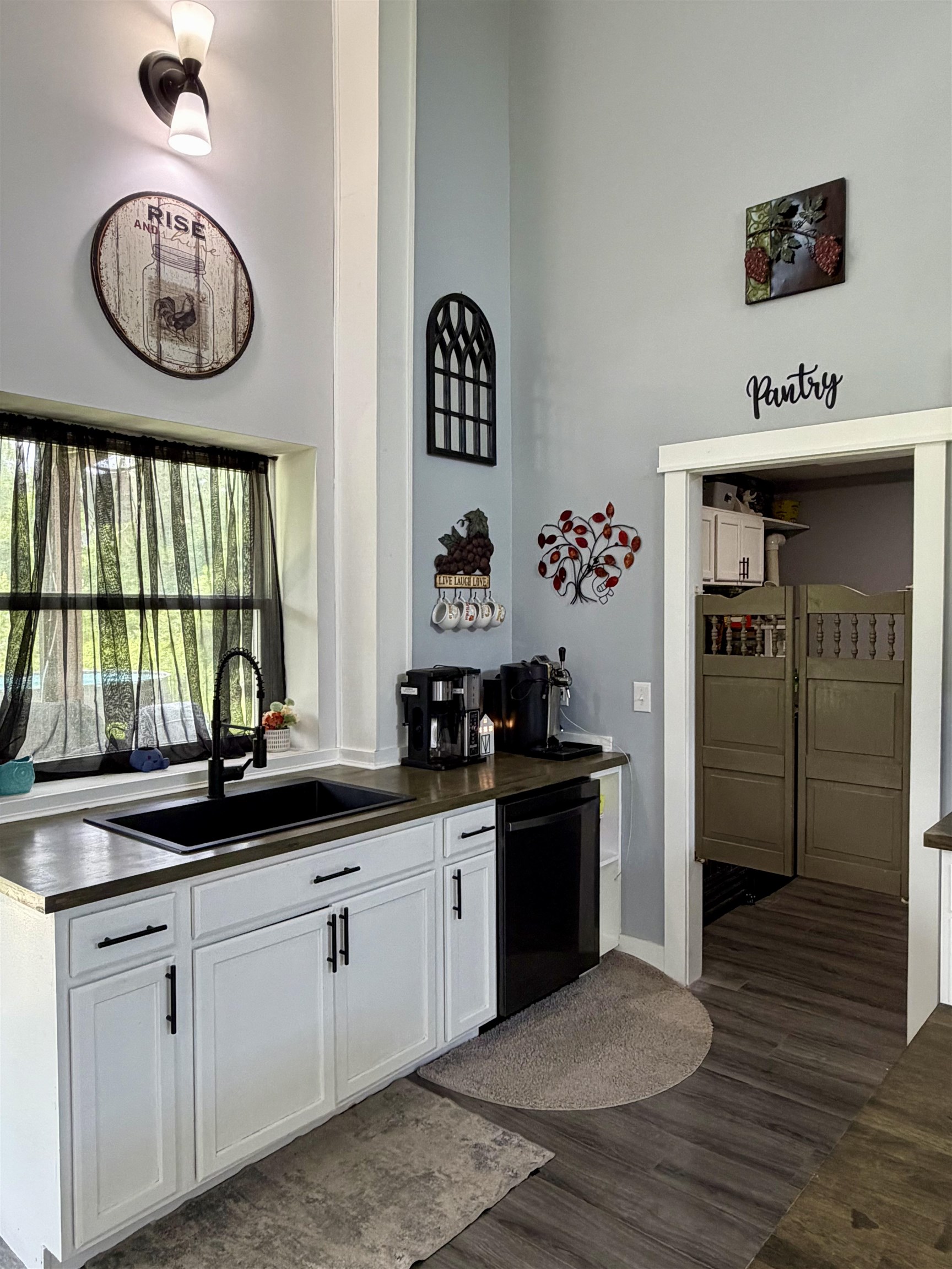 3670 Peavine Road Middleton, TN 38052 - Photo 10 of 36 Kitchen area featuring white cabinetry with matte black hardware, a black sink with a matte black faucet, and a black dishwasher