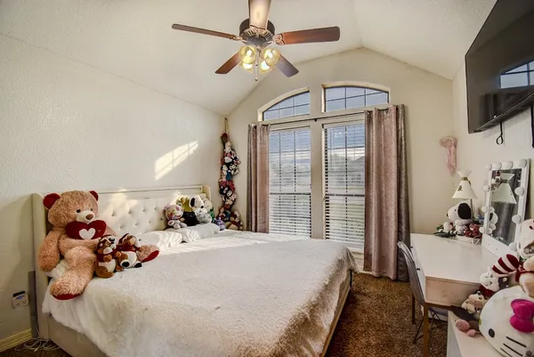 a bed room with a bed and a chandelier