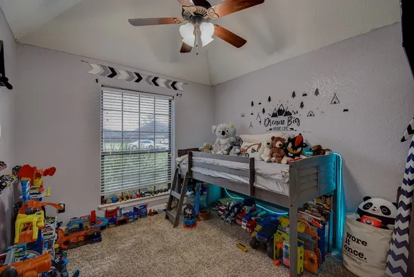 a bed room with furniture and a window