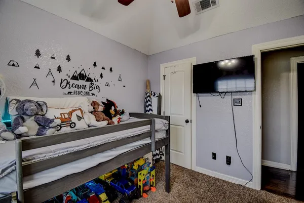 a view of living room with furniture and flat screen tv