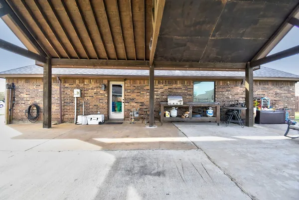 a view of a hall with an outdoor space