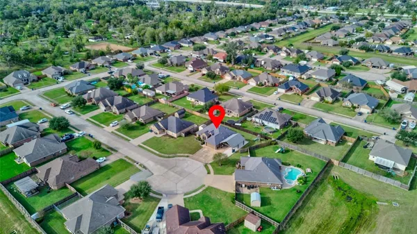an aerial view of residential houses with outdoor space