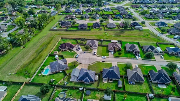 a view of swimming pool with a garden and plants