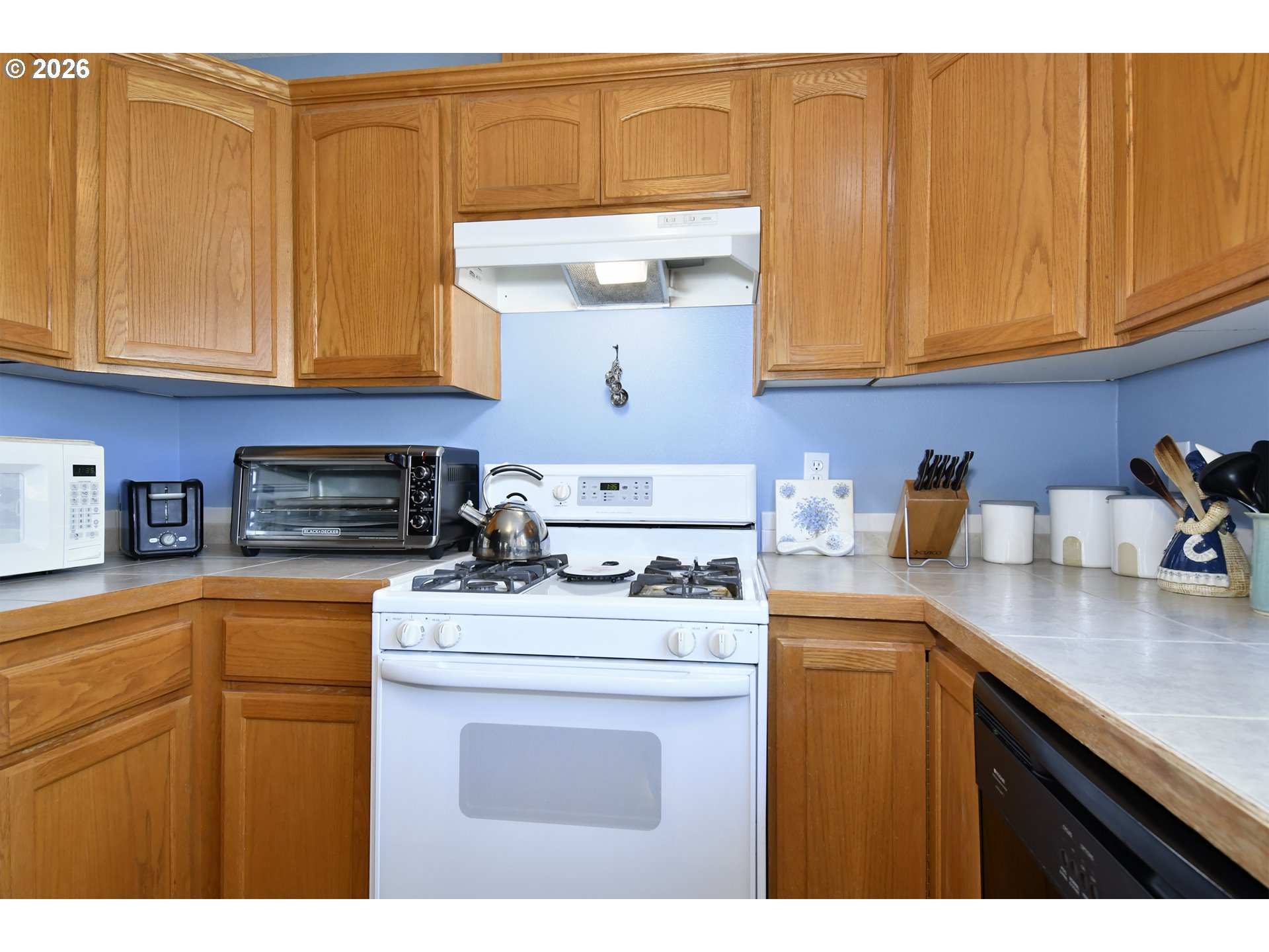 38029 Marcella Court Sandy, OR 97055 - Photo 11 of 29 a kitchen with stainless steel appliances granite countertop a sink stove and cabinets
