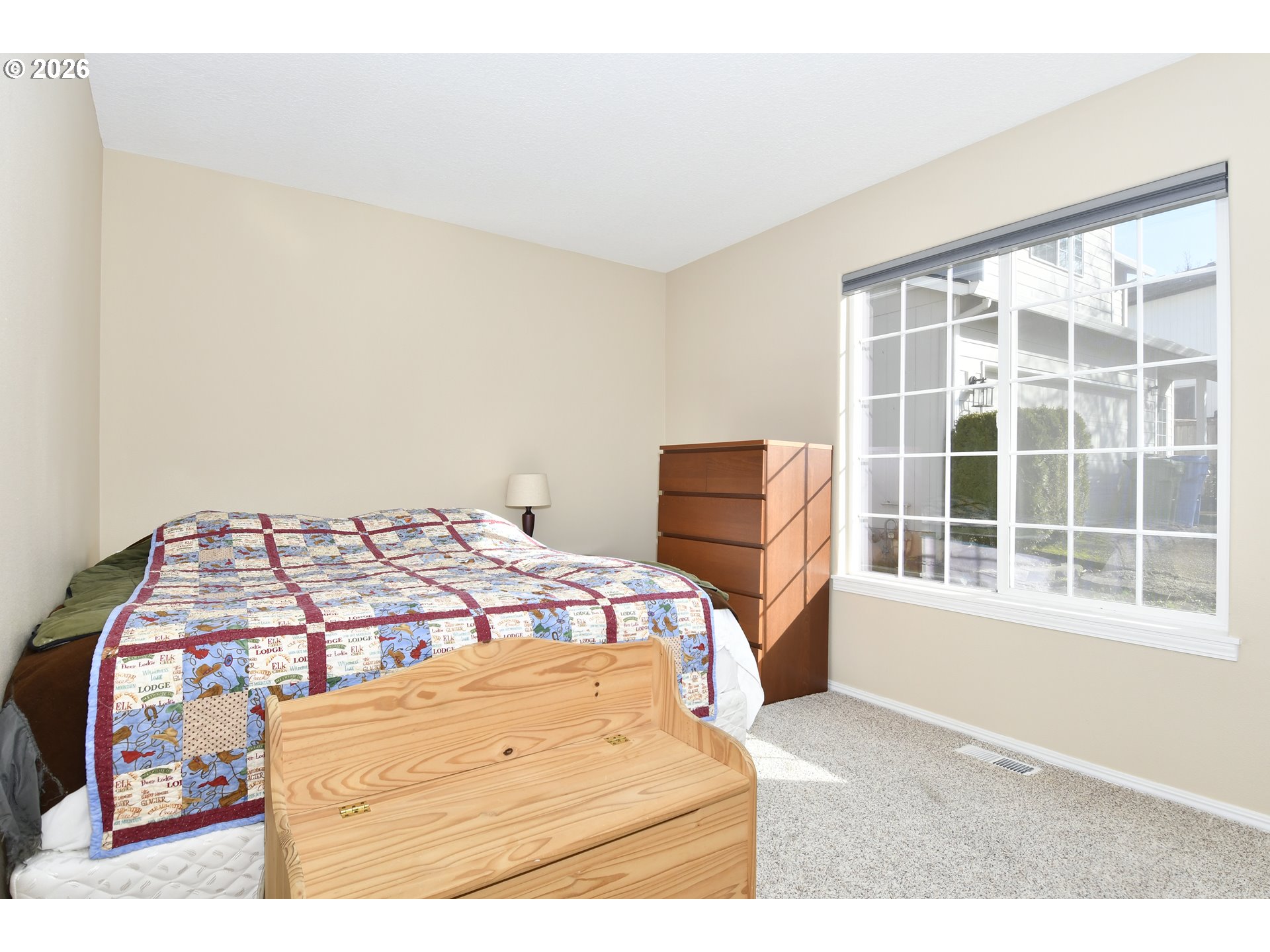38029 Marcella Court Sandy, OR 97055 - Photo 19 of 29 a bedroom with a bed and wooden floor