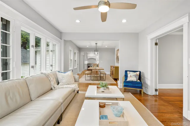 a view of living room with furniture and a wooden floor
