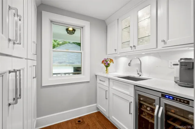 a kitchen with appliances cabinets and a window