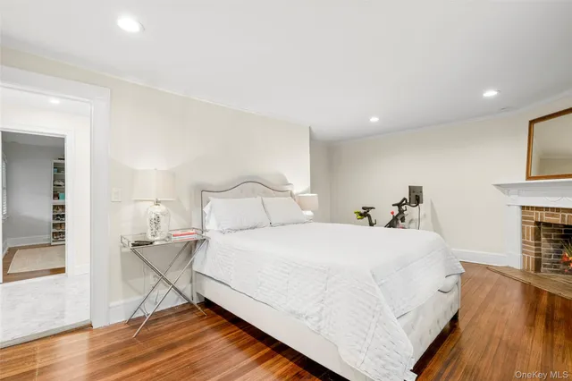 a bedroom with a bed and a fireplace