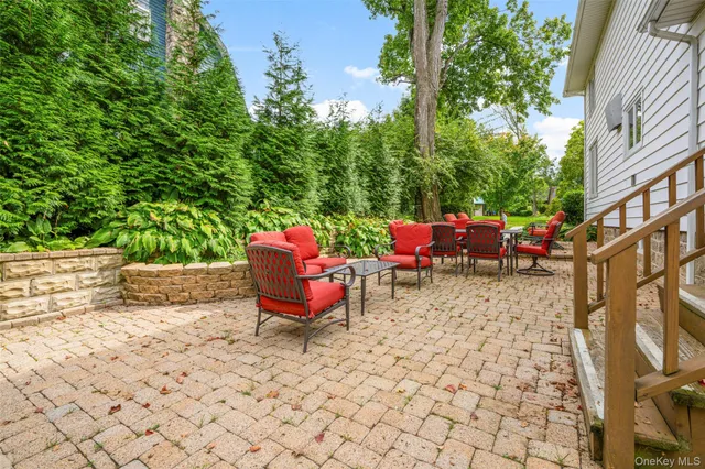 a backyard of a house with outdoor seating