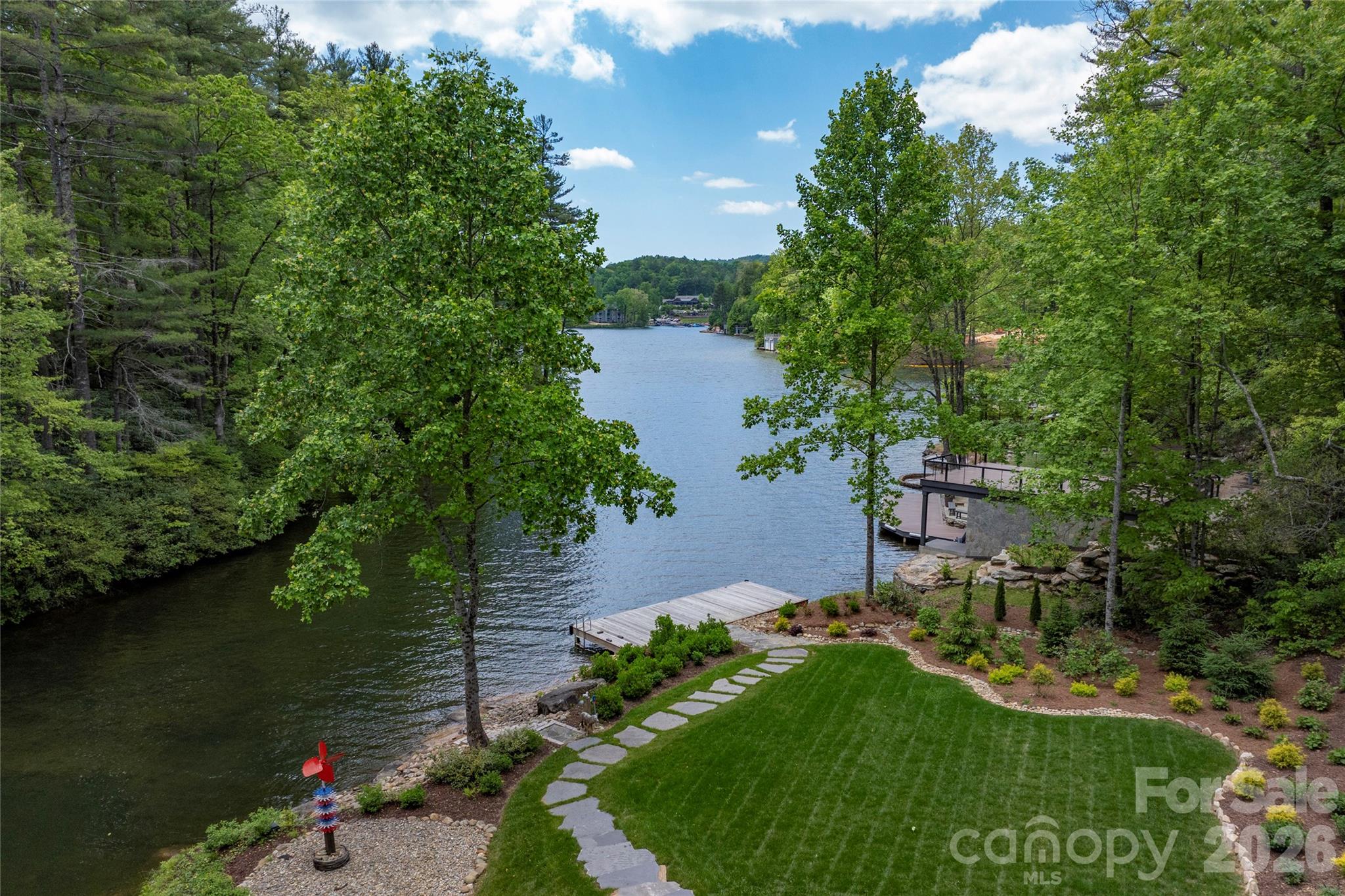 2235 Cold Mountain Road Lake Toxaway, NC 28747 - Photo 40 of 47 an aerial view of a house with a yard and lake view