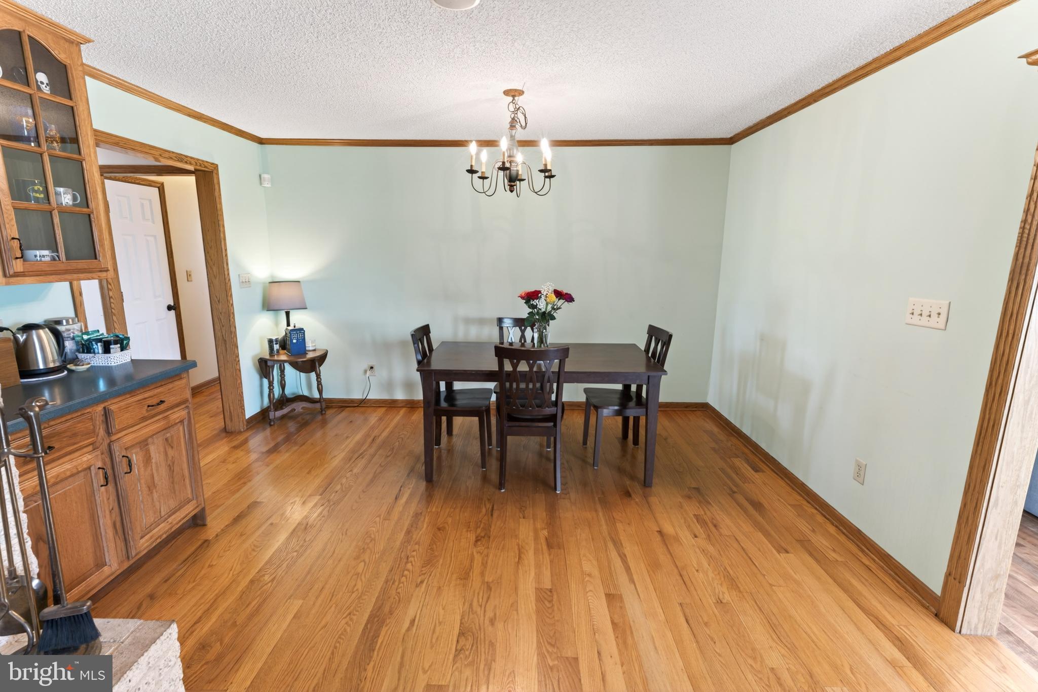 30077 Fire Tower Road Laurel, DE 19956 - Photo 23 of 87 a view of a dining room with furniture and wooden floor