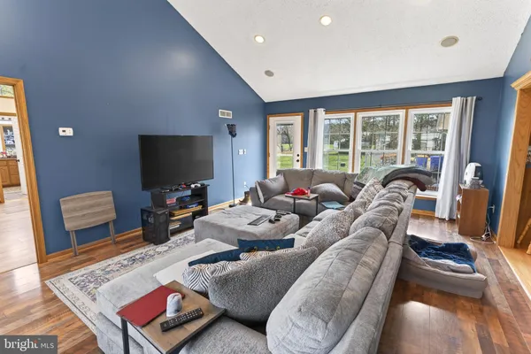 a bedroom that has a bed and a chair