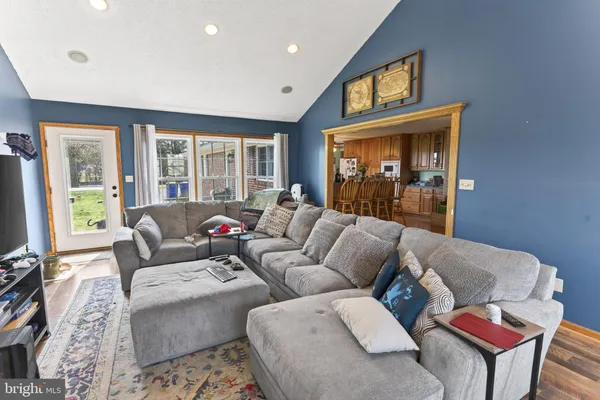 a bathroom with a sink a toilet and shower curtain