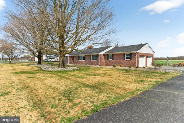 a view of a building with a yard