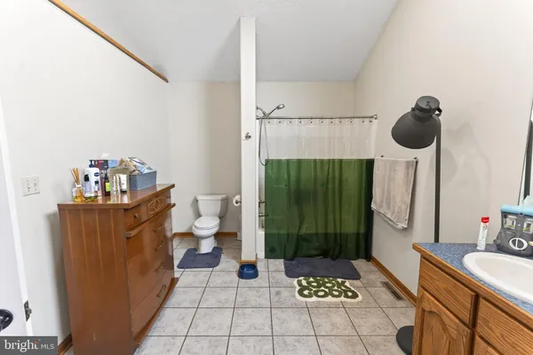 a room with gym equipment and a flat screen tv
