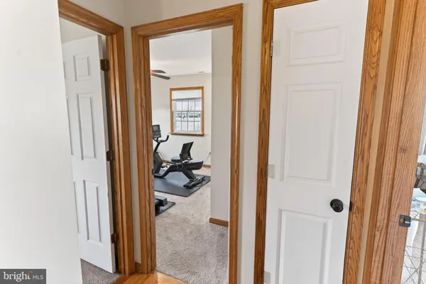 a bedroom with furniture and a baby crib