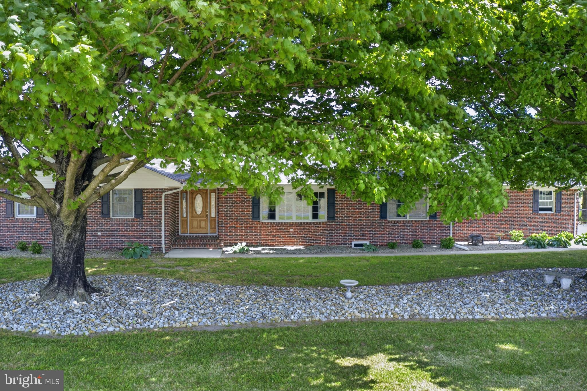 30077 Fire Tower Road Laurel, DE 19956 - Photo 4 of 87 a front view of a house with a garden