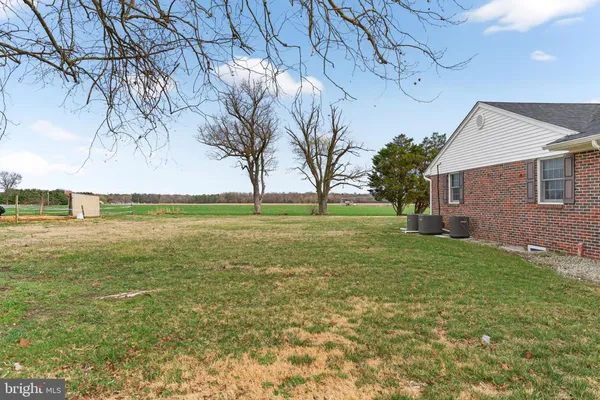 a bedroom with furniture and a wooden floor