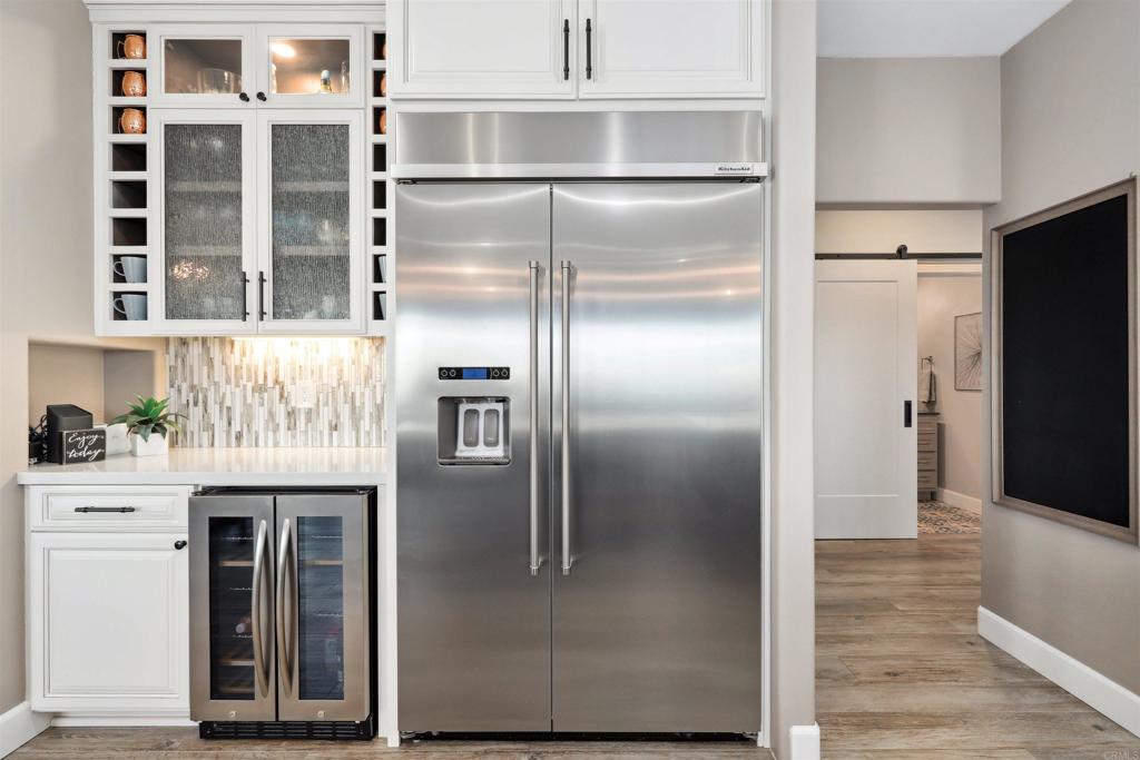 1966 Las Lomas Vista, CA 92084 - Photo 15 of 48 a kitchen with stainless steel appliances granite countertop a refrigerator and a sink