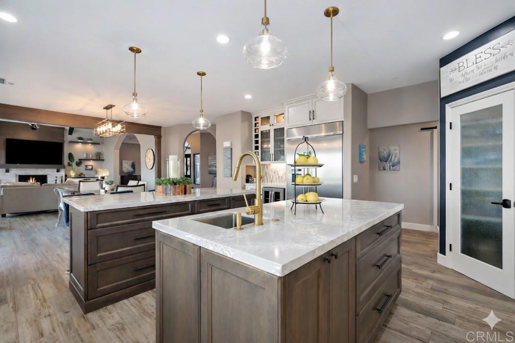 1966 Las Lomas Vista, CA 92084 - Photo 17 of 48 a kitchen with kitchen island a sink stove and refrigerator