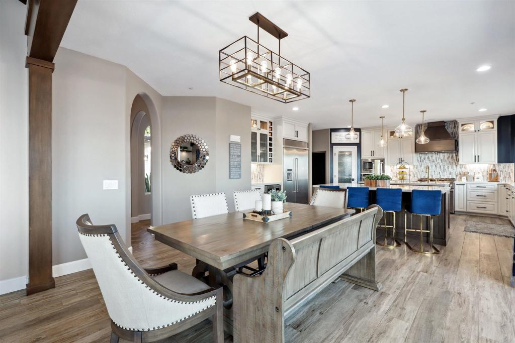 1966 Las Lomas Vista, CA 92084 - Photo 24 of 48 a view of a dining room with furniture and wooden floor