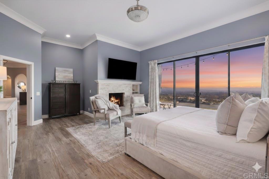 1966 Las Lomas Vista, CA 92084 - Photo 28 of 48 a bedroom with a bed and a fireplace