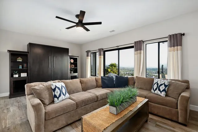 a living room with furniture and a large window