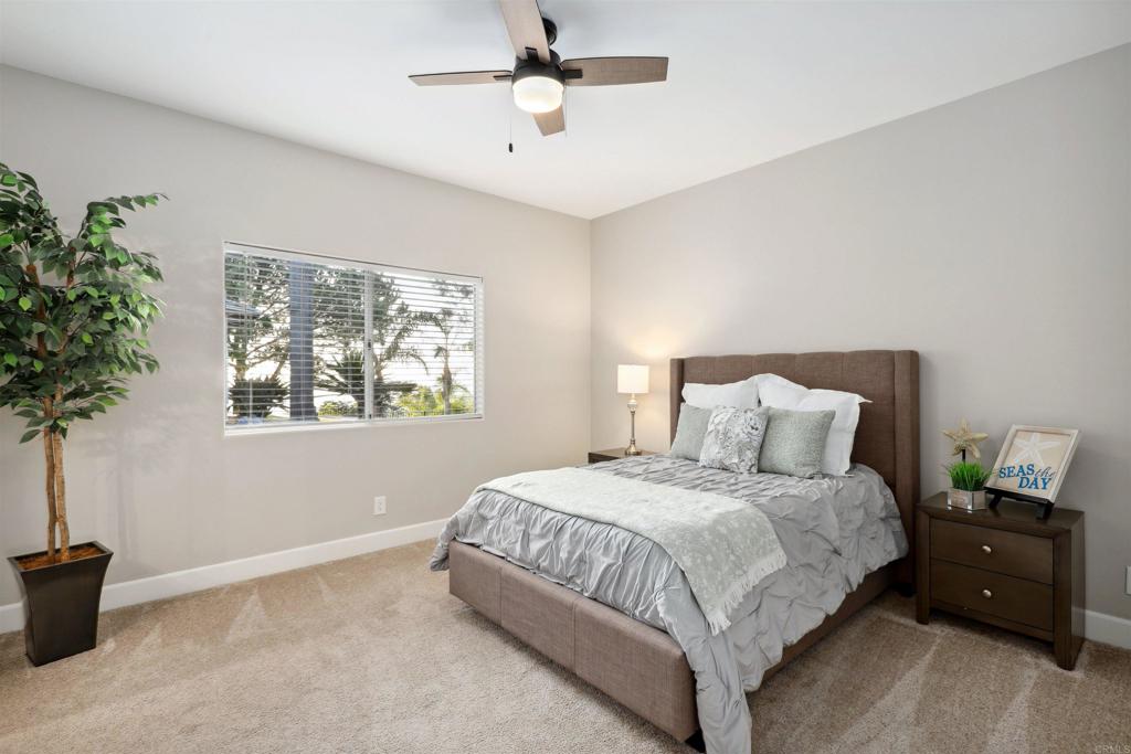 1966 Las Lomas Vista, CA 92084 - Photo 37 of 48 a bedroom with a bed and a potted plant